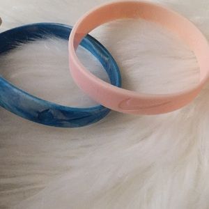 Two Nike rubber bracelets